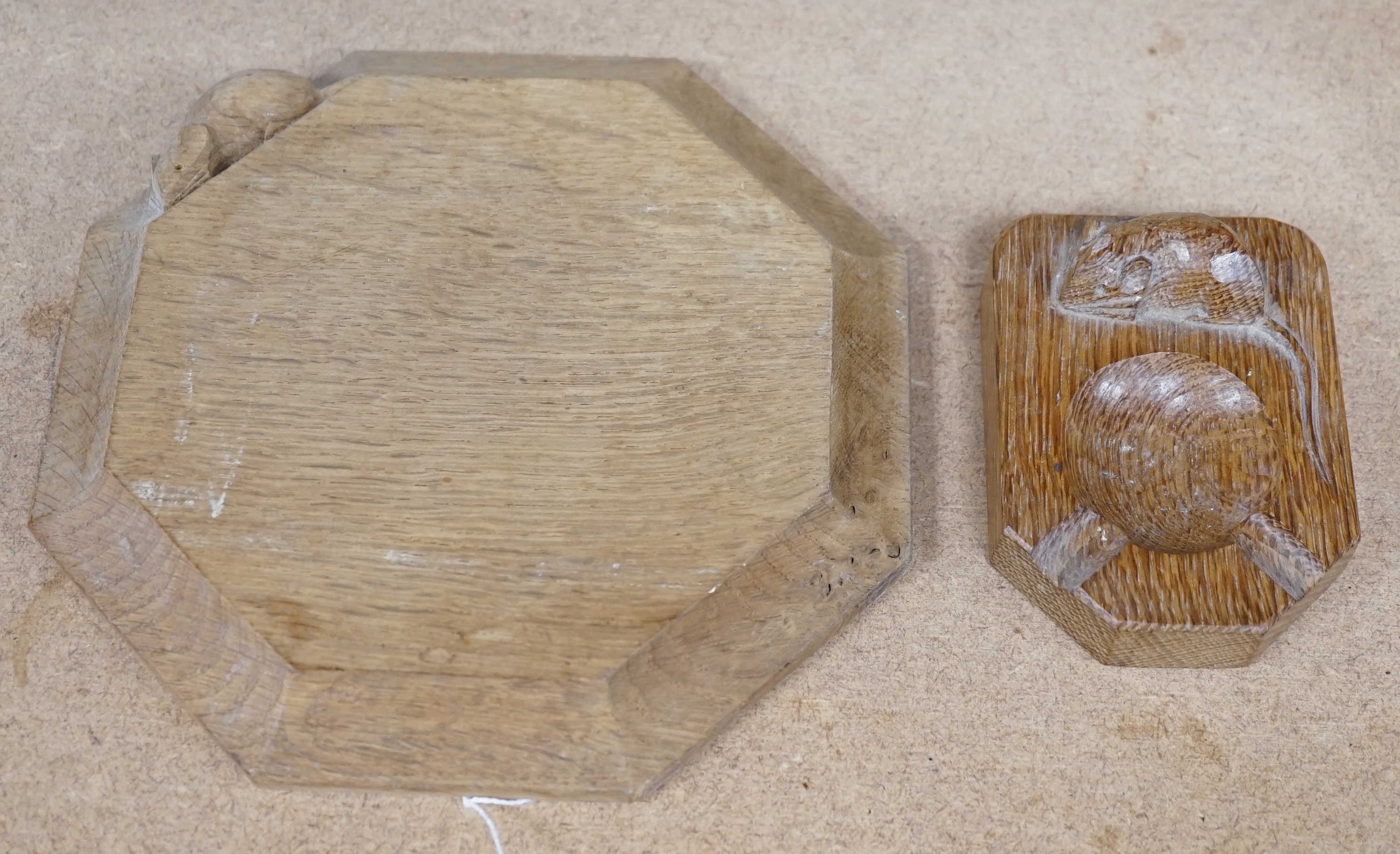 A small carved wooden Mouseman cheese board together with a Mouseman ashtray, largest 19cm wide. Condition - fair to good